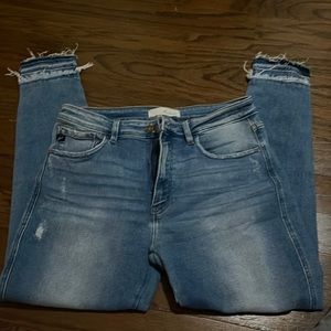 Light jeans with distressed bottom